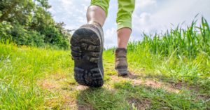 person walking in a trail